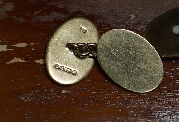 A pair of 9ct gold and seed pearl cufflinks, each end of oval outline, two accented with half pearls, to chain link connections, each end 1.9 x 1.3cm, British hallmarks, date letter for 1991, gross weight approximately 9